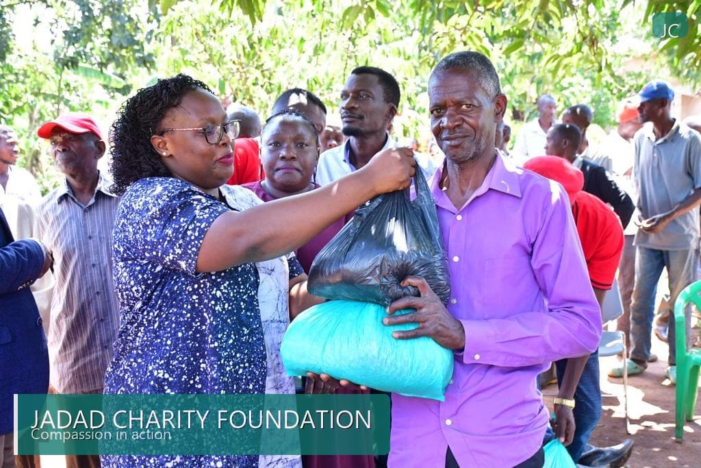 Community member receiving relief supplies from Jadad Charity Foundation